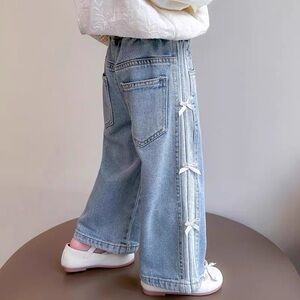 Stylish Light Blue Jeans with Bow Accents